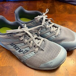 Inov-8 blue cross training shoes.